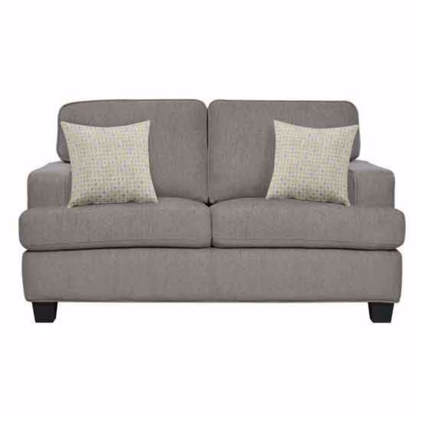 A cozy taupe loveseat with plush cushions and two patterned throw pillows, featuring a clean, contemporary design with black legs, set against a white background.