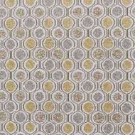 A close-up of a fabric pattern with geometric designs in gold and gray, commonly used for accent pillows or upholstery.
